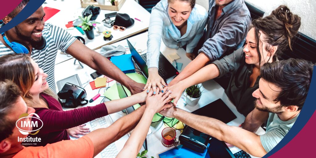 young-diverse-team-celebrating-collaboration-at-workspace-at-imm-institute