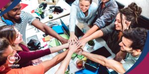 young-diverse-team-celebrating-collaboration-at-workspace-at-imm-institute